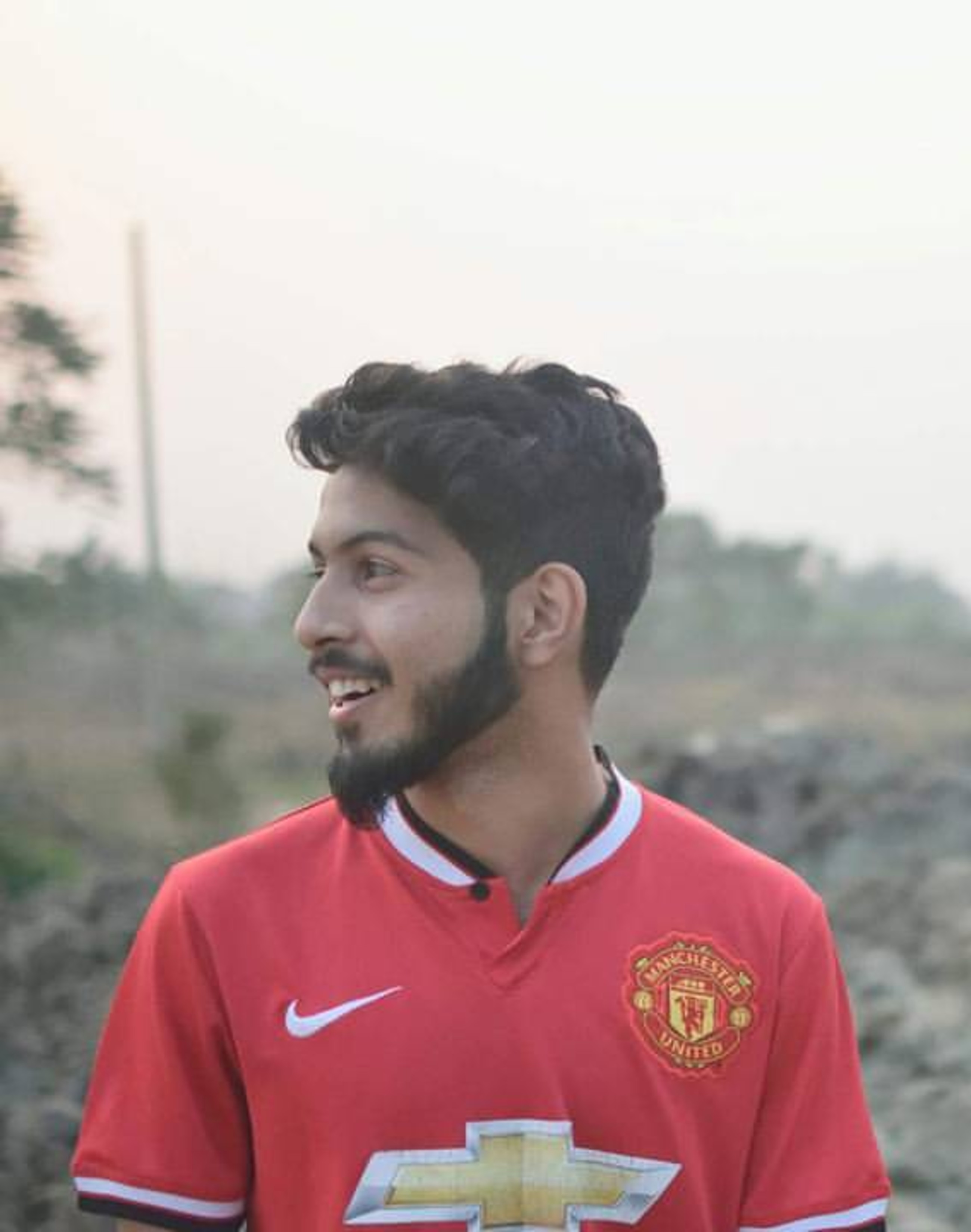 Abdullah wearing a Manchester United jersey